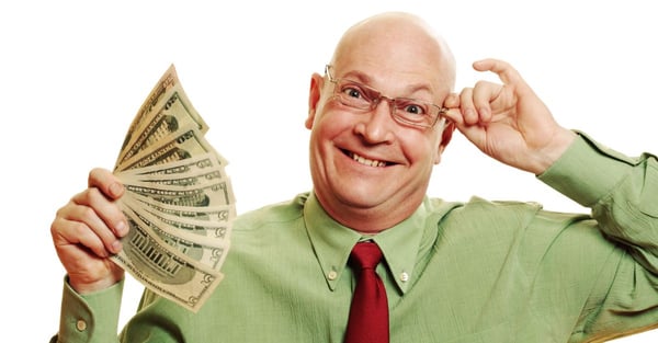image of a man happily holding a fan of money.